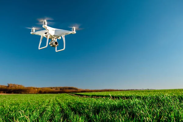 depositphotos_409465742-stock-photo-drone-quad-copter-green-corn (1)