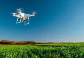 depositphotos_409465742-stock-photo-drone-quad-copter-green-corn (1)